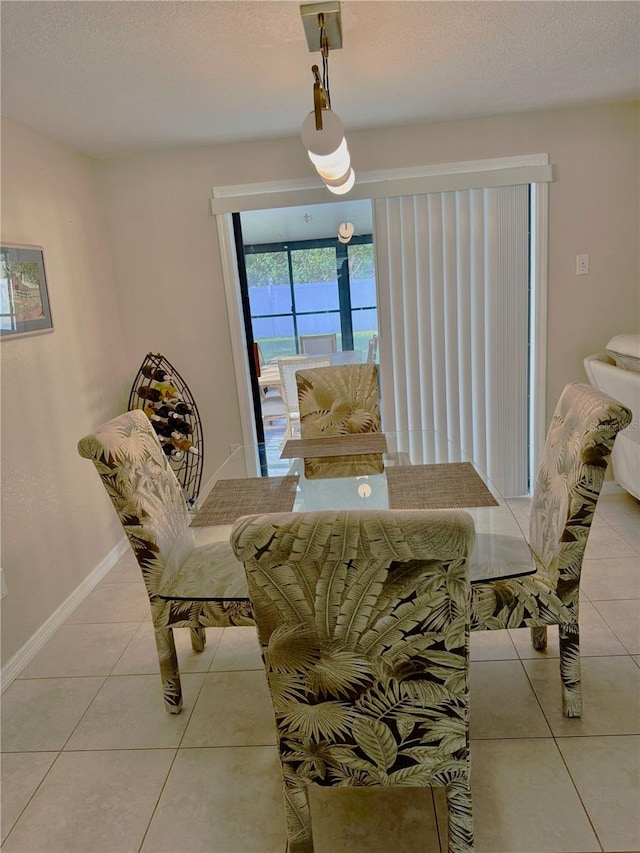 4121 Durant St, Port Charlotte, FL 33948 - tiled dining space featuring baseboards and a textured ceiling