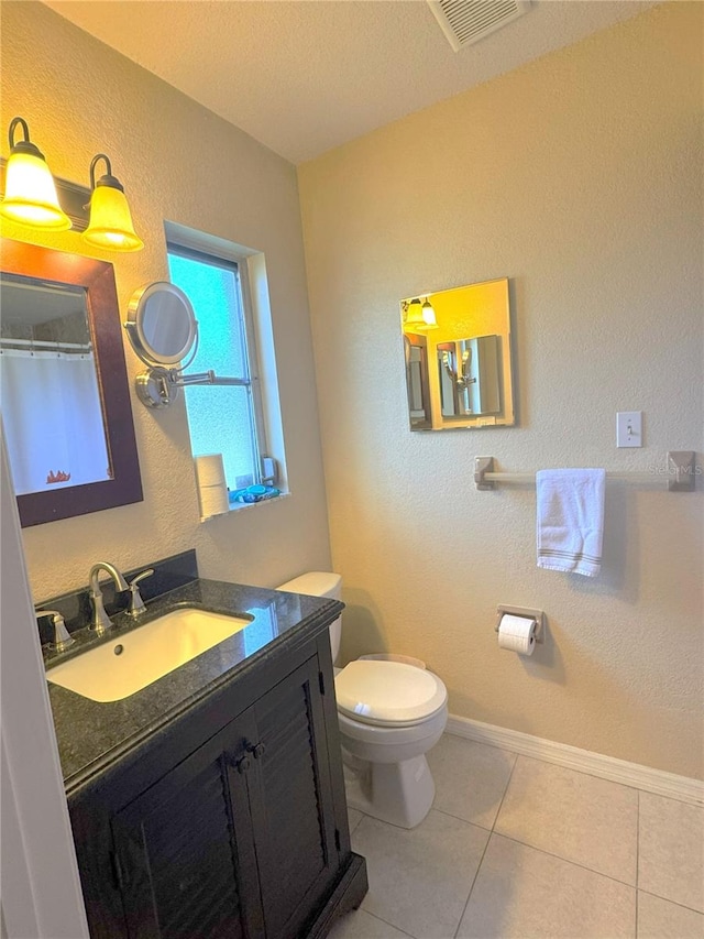 4121 Durant St, Port Charlotte, FL 33948 - bathroom featuring vanity, a textured wall, and tile patterned flooring