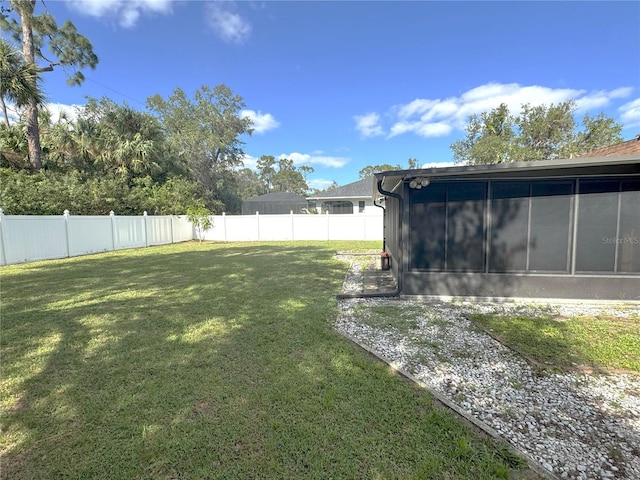 view of yard featuring a sunroom