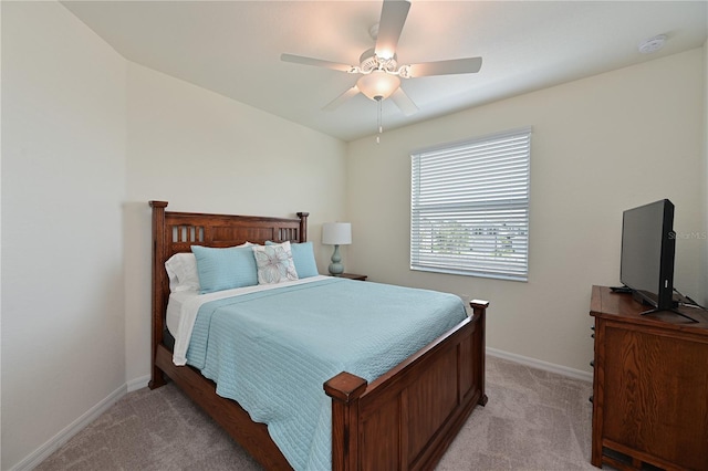 bedroom featuring ceiling fan and light colored carpet