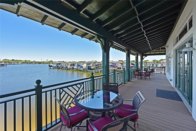 wooden terrace with a water view