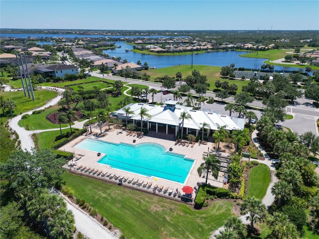 birds eye view of property with a water view