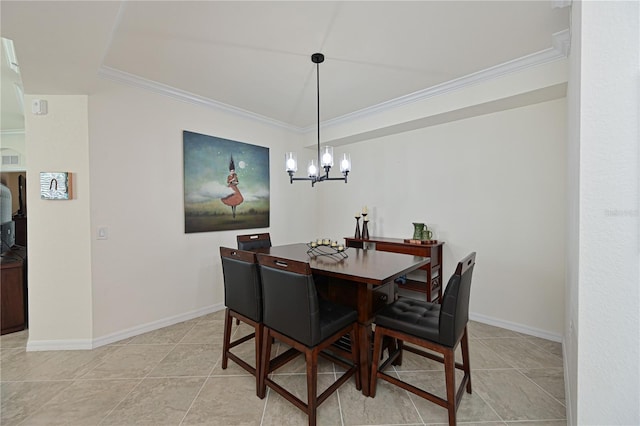 tiled dining room with a chandelier and ornamental molding