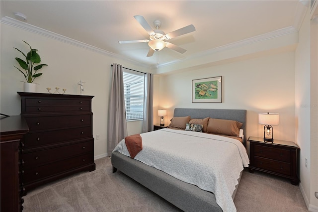 carpeted bedroom with ceiling fan and crown molding