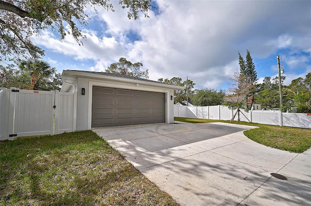 garage featuring a lawn