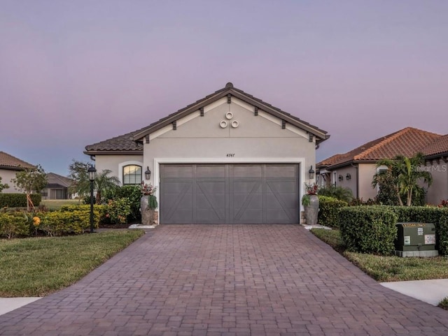 mediterranean / spanish-style home featuring a yard