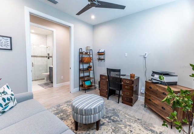 office area with ceiling fan and light hardwood / wood-style floors