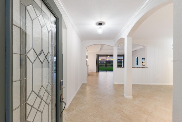 13627 American Prairie Pl, Lakewood Ranch, FL 34211 - entryway with arched walkways, crown molding, light tile patterned floors, and baseboards