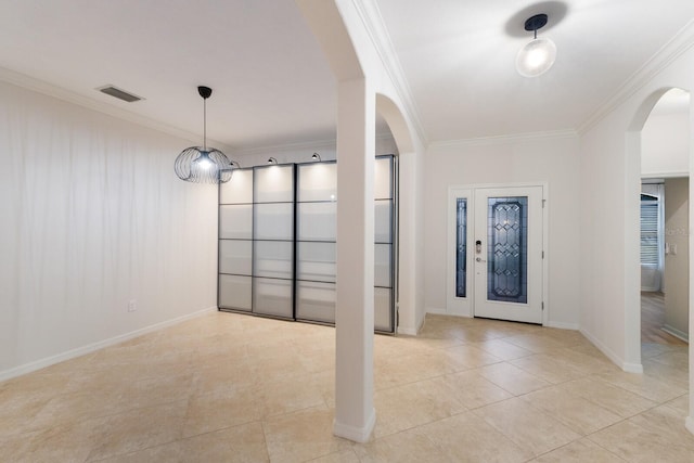 13627 American Prairie Pl, Lakewood Ranch, FL 34211 - foyer entrance featuring arched walkways, ornamental molding, light tile patterned floors, and baseboards