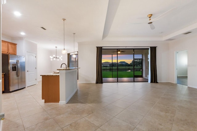 13627 American Prairie Pl, Lakewood Ranch, FL 34211 - kitchen with stainless steel fridge with ice dispenser, light tile patterned floors, light stone counters, a ceiling fan, and crown molding