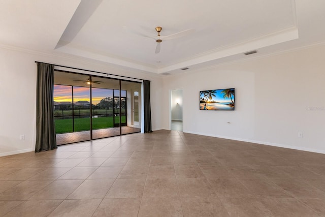 13627 American Prairie Pl, Lakewood Ranch, FL 34211 - tiled spare room with a tray ceiling, ceiling fan, ornamental molding, and baseboards