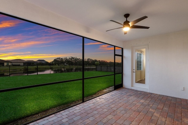13627 American Prairie Pl, Lakewood Ranch, FL 34211 - unfurnished sunroom with a water view and ceiling fan