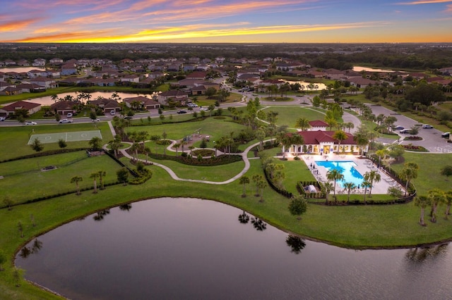 13627 American Prairie Pl, Lakewood Ranch, FL 34211 - aerial view at dusk of view of pool area, a water view, and a residential view