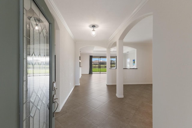 entryway featuring tile patterned flooring and ornamental molding