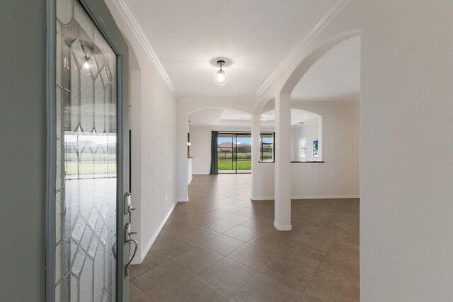 13627 American Prairie Pl, Lakewood Ranch, FL 34211 - tiled foyer featuring arched walkways, crown molding, and baseboards
