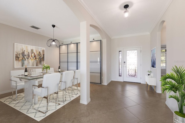 13627 American Prairie Pl, Lakewood Ranch, FL 34211 - tiled entryway with arched walkways, crown molding, and baseboards