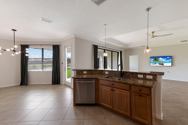 13627 American Prairie Pl, Lakewood Ranch, FL 34211 - kitchen featuring dishwasher, a sink, light tile patterned floors, crown molding, and dark stone counters