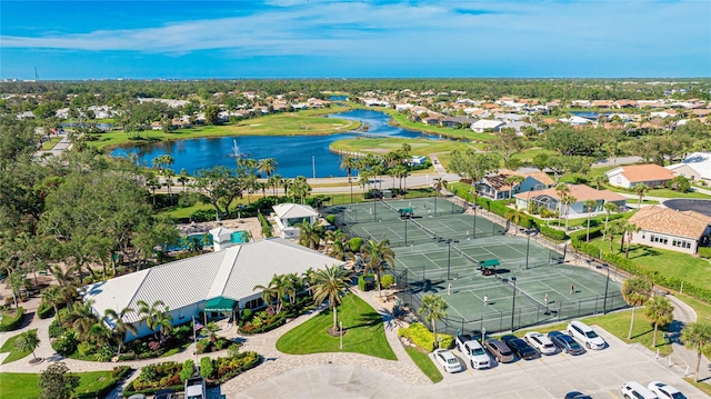 birds eye view of property with a water view