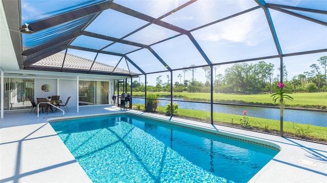 view of pool featuring a lanai, a water view, and a patio