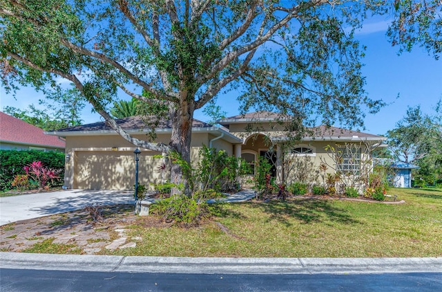 view of front facade featuring a front yard and a garage