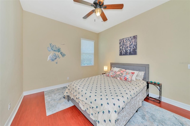 bedroom with wood-type flooring and ceiling fan