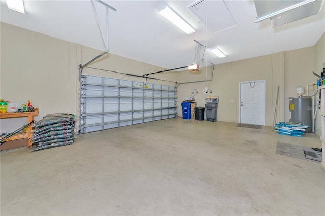 garage with a garage door opener and water heater