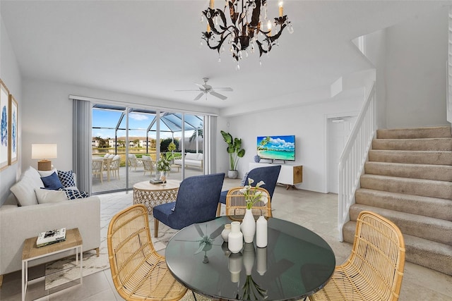 tiled dining room with ceiling fan with notable chandelier