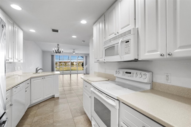 kitchen featuring decorative light fixtures, white cabinetry, light tile patterned flooring, and white appliances