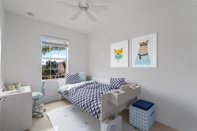 bedroom featuring ceiling fan and light colored carpet