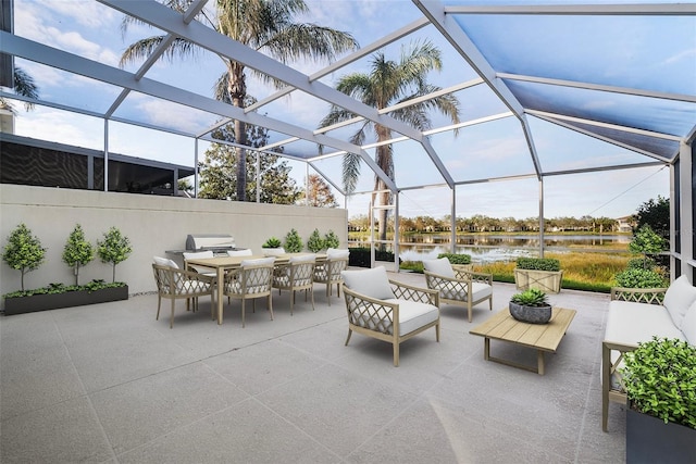 view of patio / terrace with outdoor lounge area, a water view, and a lanai