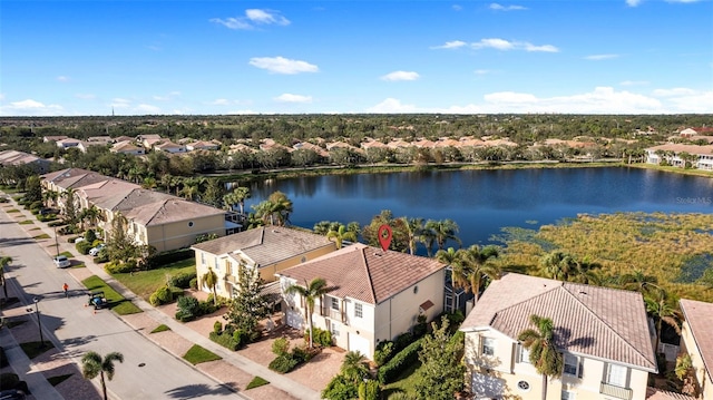 birds eye view of property with a water view