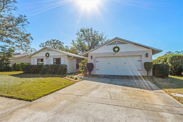 ranch-style house with a garage and a front yard