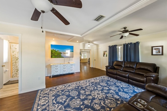 living room featuring dark hardwood / wood-style floors, ceiling fan, and crown molding