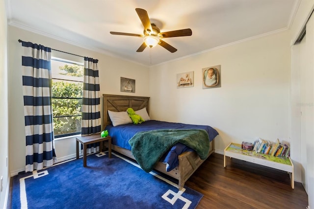 bedroom with ceiling fan, dark hardwood / wood-style flooring, and ornamental molding