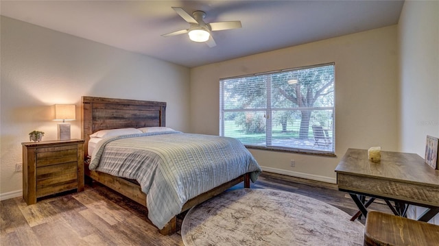 bedroom featuring hardwood / wood-style flooring and ceiling fan