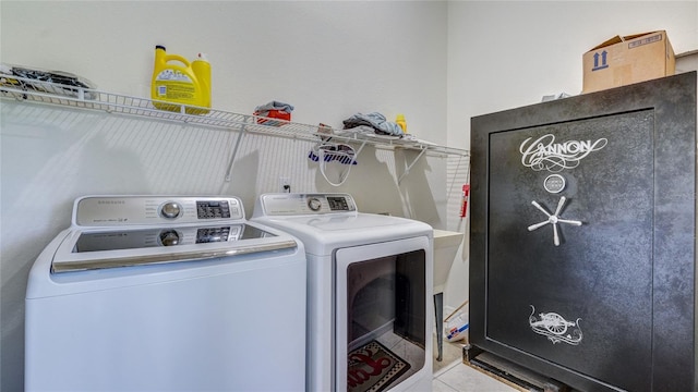 laundry area with washing machine and clothes dryer