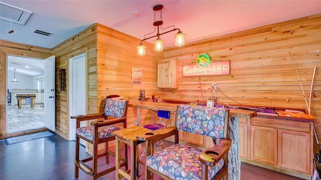 living area featuring wooden walls