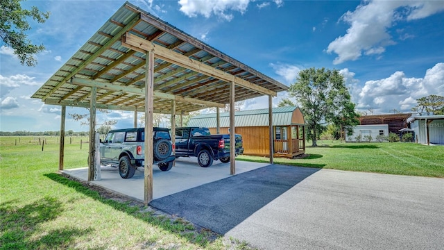 view of parking / parking lot with a lawn and a carport