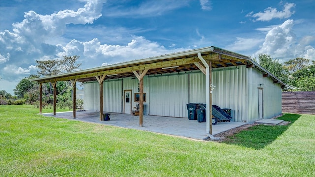 view of outbuilding featuring a yard