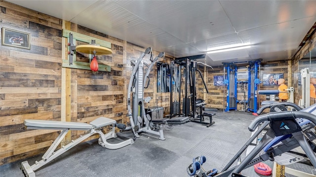 workout area with wood walls