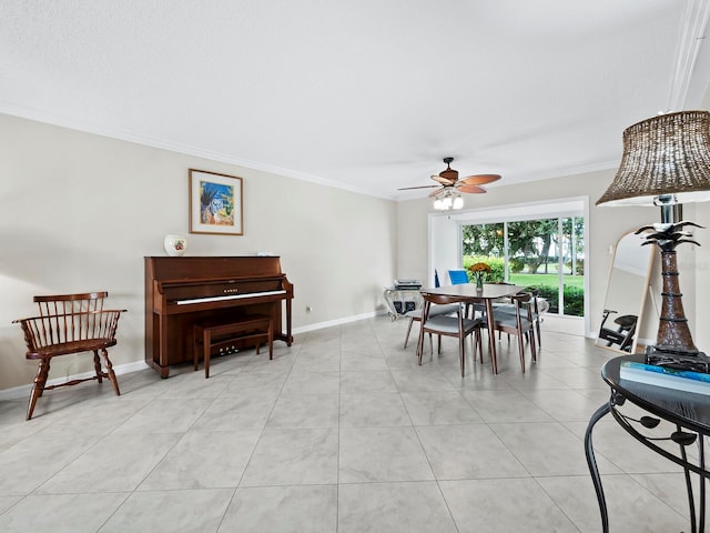 dining room with ceiling fan, light tile patterned flooring, and crown molding