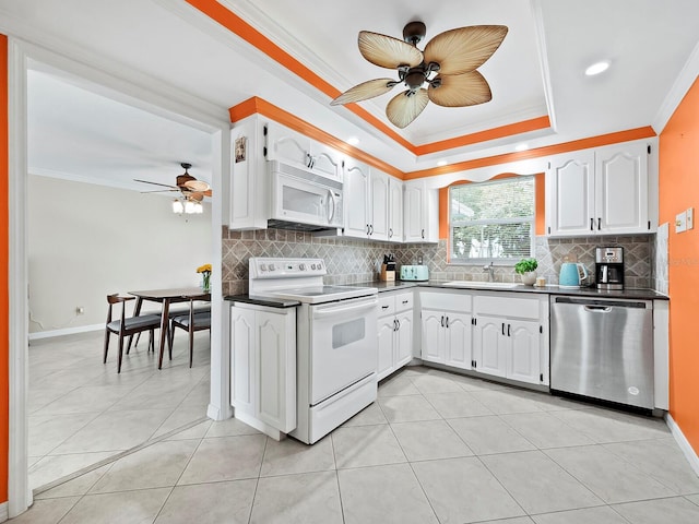 kitchen featuring stainless steel dishwasher, white cabinetry, electric stove, and crown molding