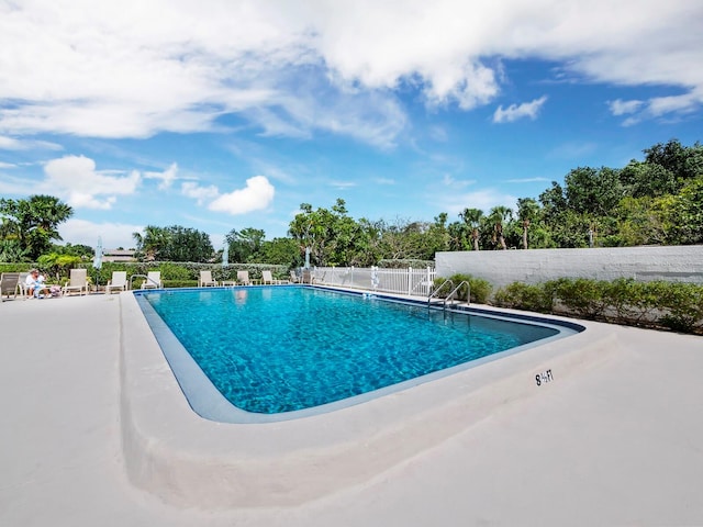 view of swimming pool with a patio area