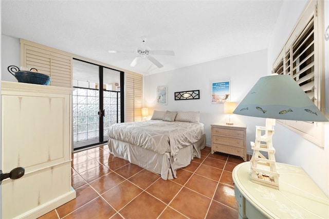 tiled bedroom featuring access to outside and ceiling fan