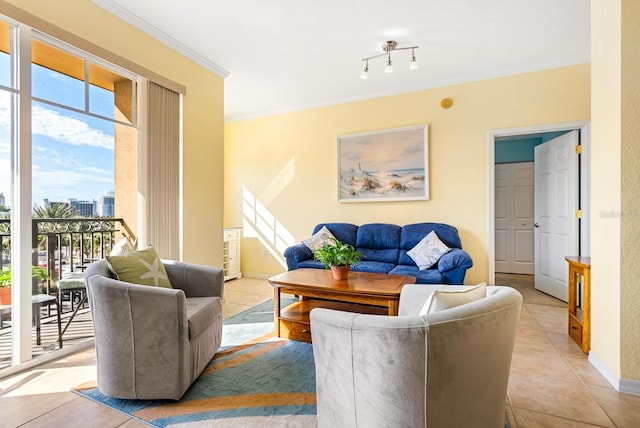 living room with light tile patterned floors and crown molding