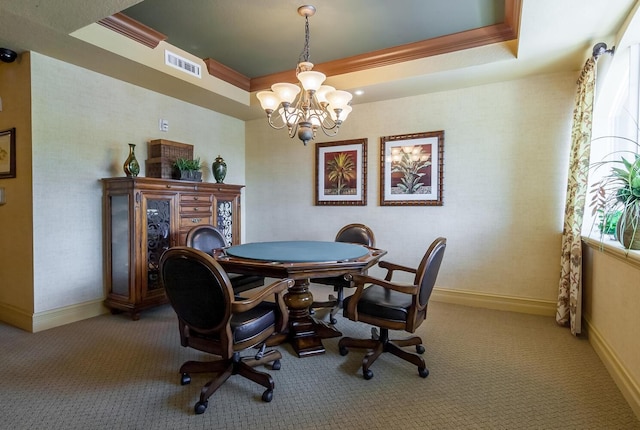 interior space featuring carpet, a chandelier, crown molding, and a tray ceiling