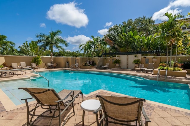 view of swimming pool with a patio area