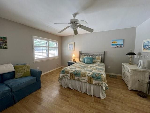 bedroom featuring light hardwood / wood-style flooring and ceiling fan