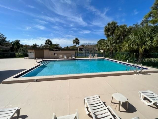 view of swimming pool featuring a patio