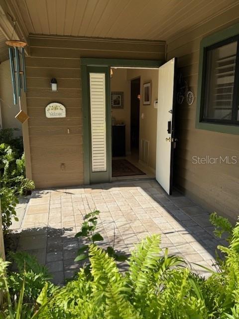 property entrance with a patio area